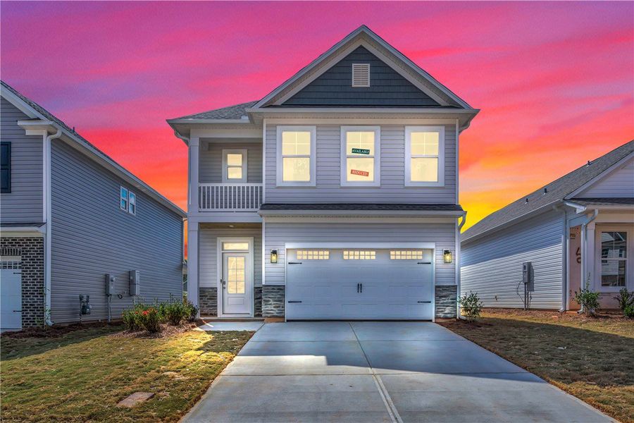 Front exterior of a new home in Brownstone Park, Easley, SC, highlighting curb appeal (Image 2).