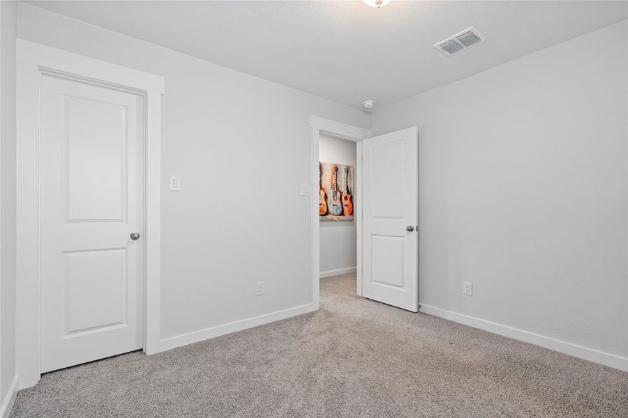 Unfurnished bedroom featuring carpet and baseboards Unfurnished bedroom featuring carpet and baseboards