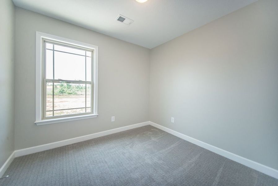 Representative unfurnished interior of a home built from the Pacific by Enchanted Homes in Hampshire Heights, Moore (Image 31).