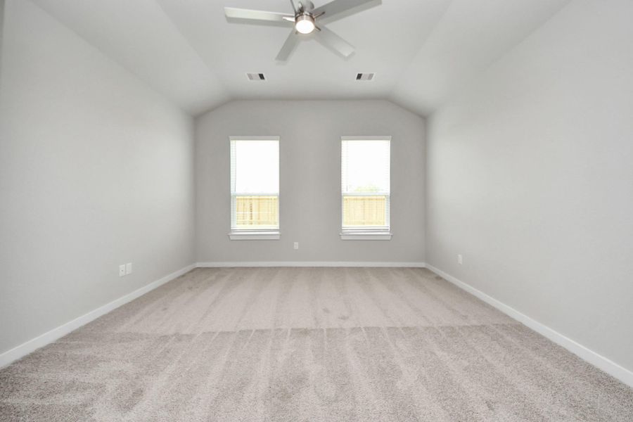 Another perspective unveils a comprehensive view of the serenity and comfort this primary suite offers. Sample photo of completed home with similar floor plan. Actual colors and selections may vary. Another perspective unveils a comprehensive view of the serenity and comfort this primary suite offers. Sample photo of completed home with similar floor plan. Actual colors and selections may vary.