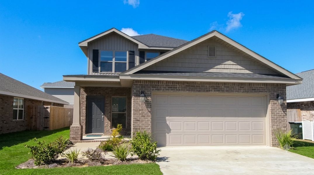 Front exterior of a new home in Pine Top, Cantonment, FL, highlighting curb appeal (Image 1). Front exterior of a new home in Pine Top, Cantonment, FL, highlighting curb appeal (Image 1).