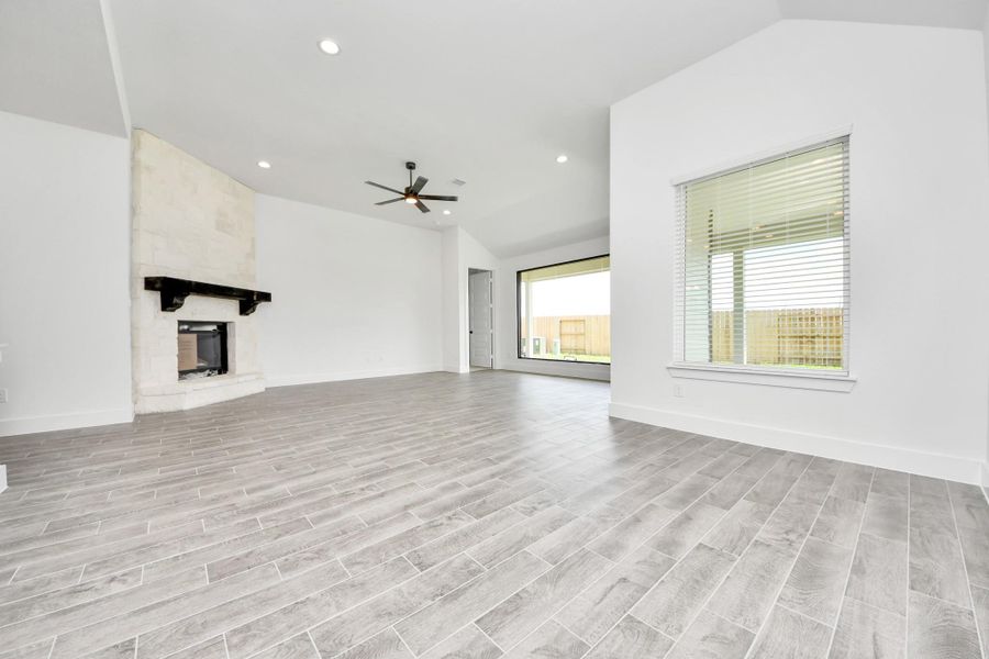 Relax and unwind in this inviting family room, illuminated by abundant natural light streaming in through tall windows, complemented by high ceilings and stunning flooring. Stay comfortable year-round with the gentle breeze from the ceiling fan, creating the perfect atmosphere for family gatherings. Relax and unwind in this inviting family room, illuminated by abundant natural light streaming in through tall windows, complemented by high ceilings and stunning flooring. Stay comfortable year-round with the gentle breeze from the ceiling fan, creating the perfect atmosphere for family gatherings.