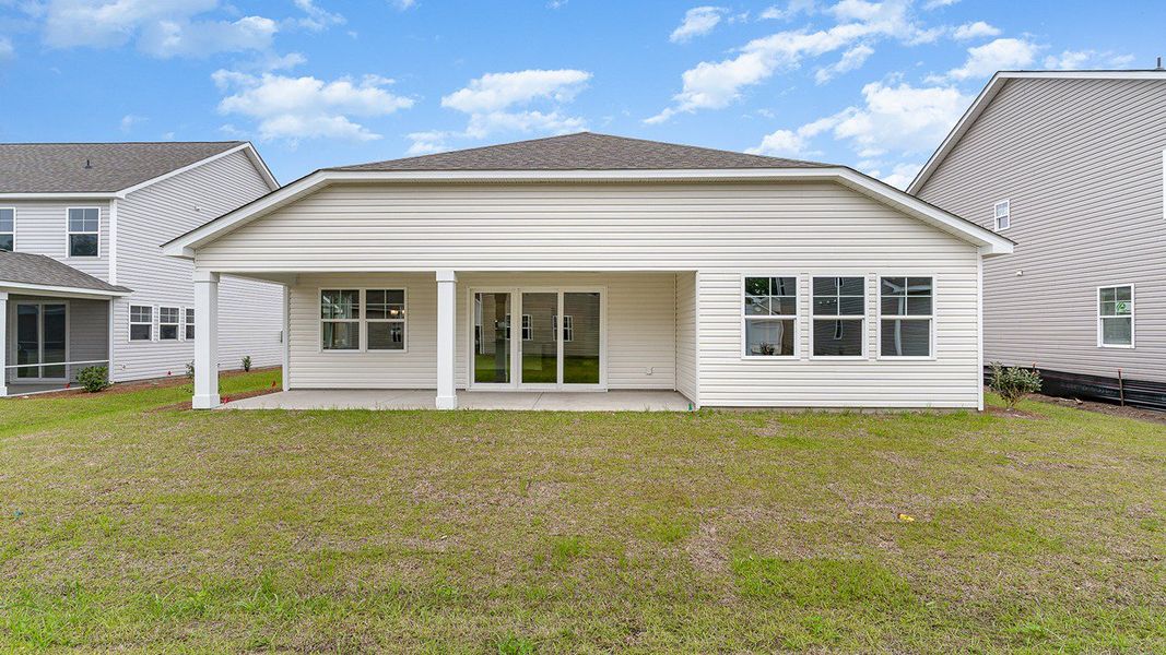 Representative exterior photo of a completed home built from the EATON by D.R. Horton in Spring View Landing, Loris, SC (Image 14).