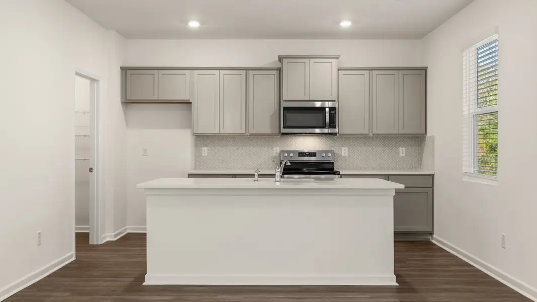 Representative furnished interior of a home built from the Galen by D.R. Horton in The Reserve at Calcutta, Stockbridge (Image 6).