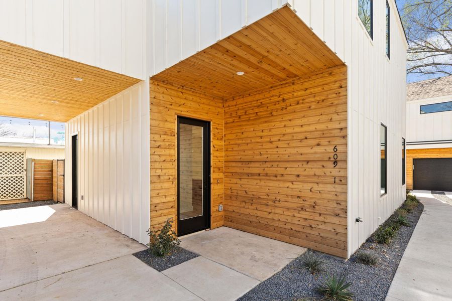 Doorway to property featuring a patio area