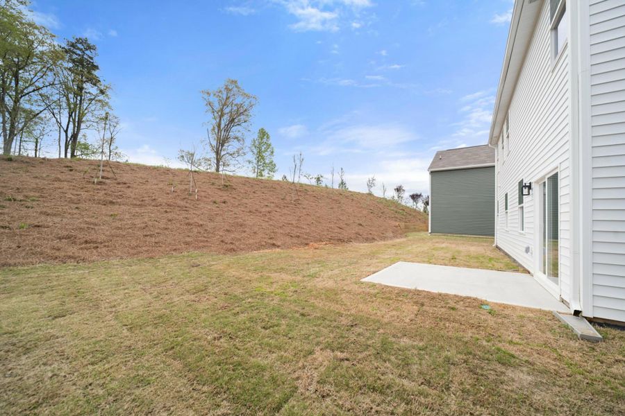 Front exterior of a new home in Chandler Ridge, McLeansville, NC, highlighting curb appeal (Image 19).