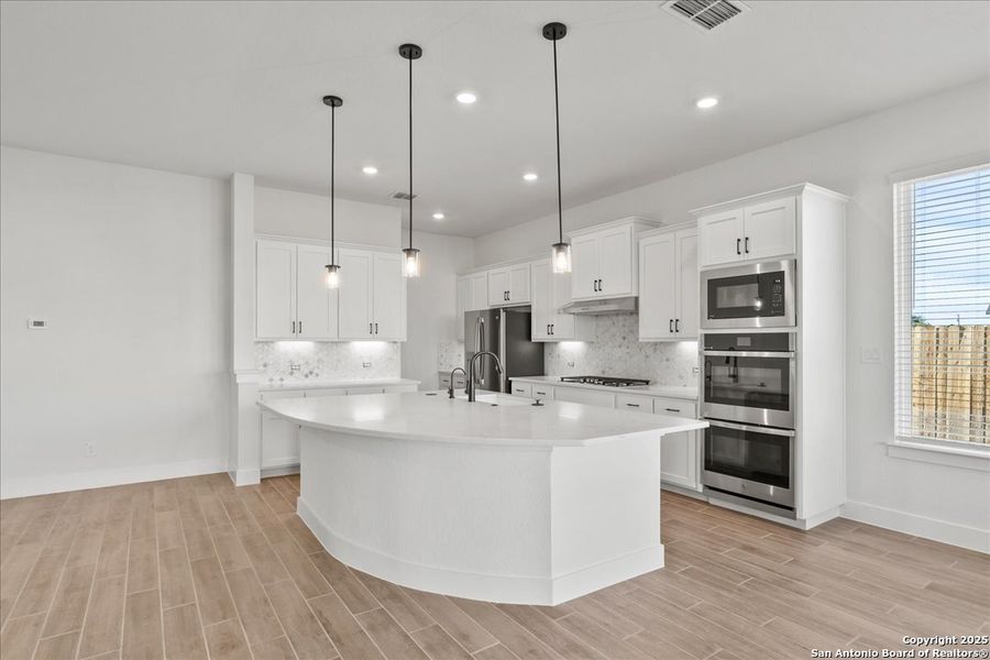 Furnished interior view inside a new home in Village at Three Oaks, Seguin (Image 9).
