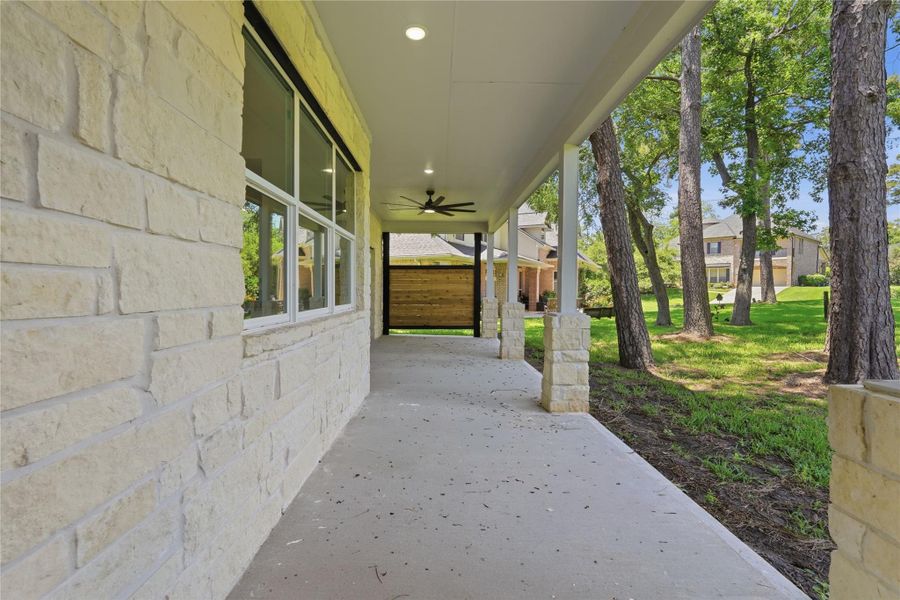 First floor back patio and views of massive mature trees. First floor back patio and views of massive mature trees.