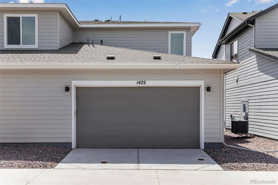 Front exterior of a new home in Sugar Mill Village, Longmont, CO, highlighting curb appeal (Image 18).