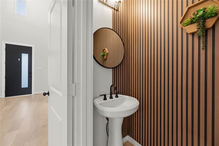 A convenient guest half bath found on the first floor
