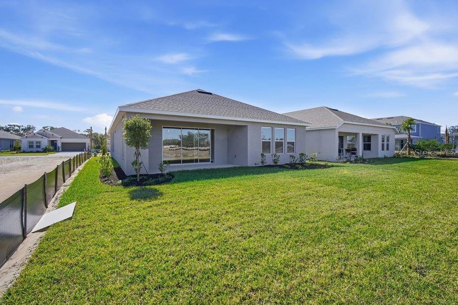 Exterior details and patio area of a home in Firethorn, Parrish (Image 4).