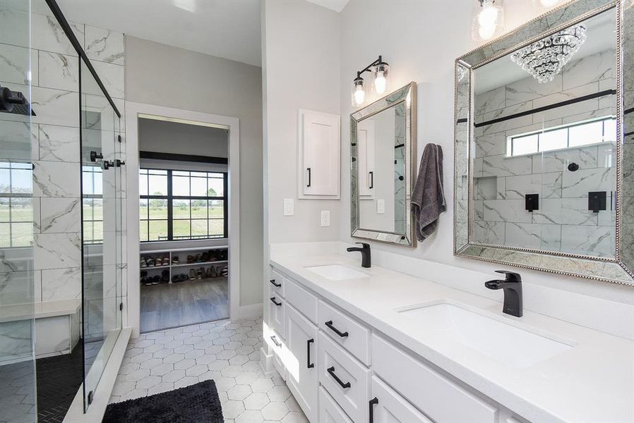 En-suite primary bathroom with double vanities