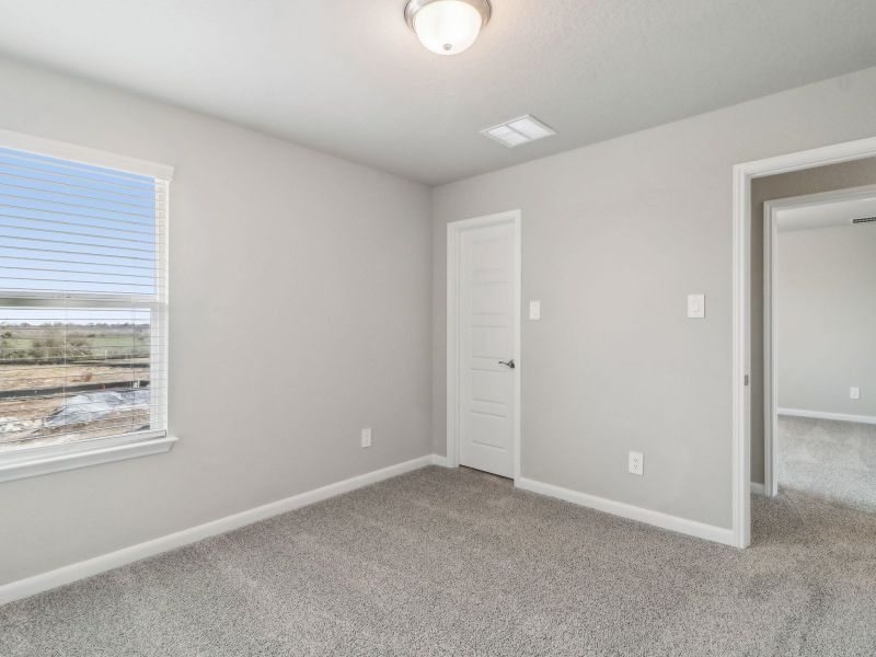 Guest bedroom in the Medina floorplan at a Meritage Homes community. Guest bedroom in the Medina floorplan at a Meritage Homes community.