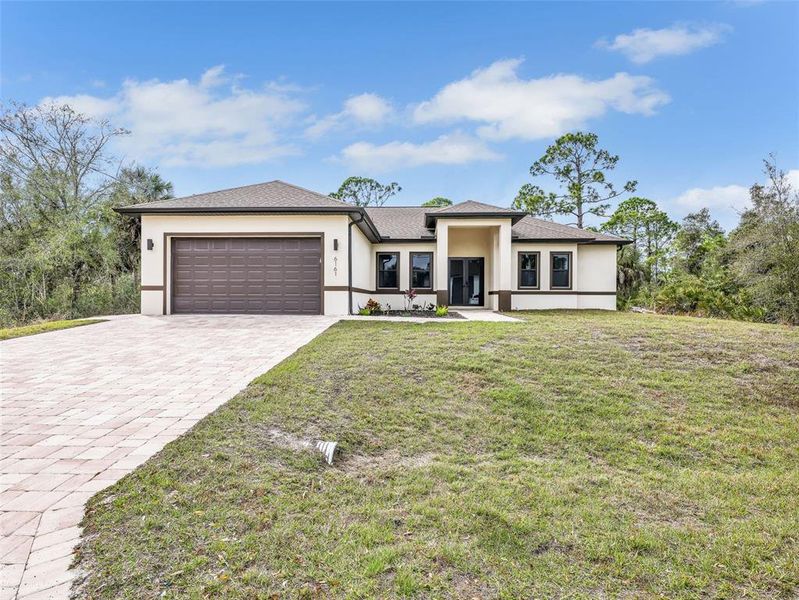 Front exterior of a new home in , Port Charlotte, FL, highlighting curb appeal (Image 25).
