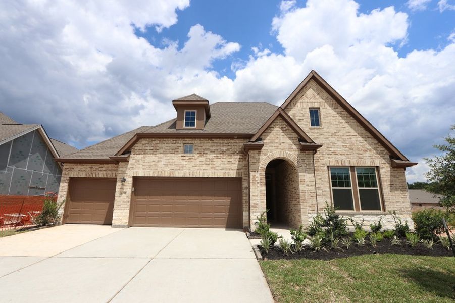 Representative exterior photo of a completed home built from the The Conway by David Weekley Homes in Escondido 60' Homesites, Magnolia, TX (Image 2).