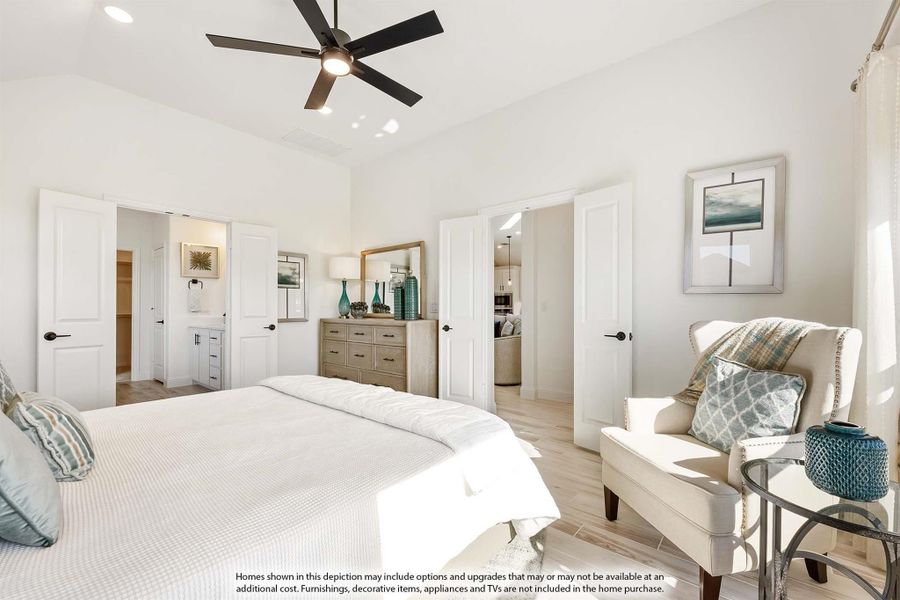 Master bedroom with ceiling fan, hardwood floors, walk-in closet, and ensuite bathroom access Master bedroom with ceiling fan, hardwood floors, walk-in closet, and ensuite bathroom access