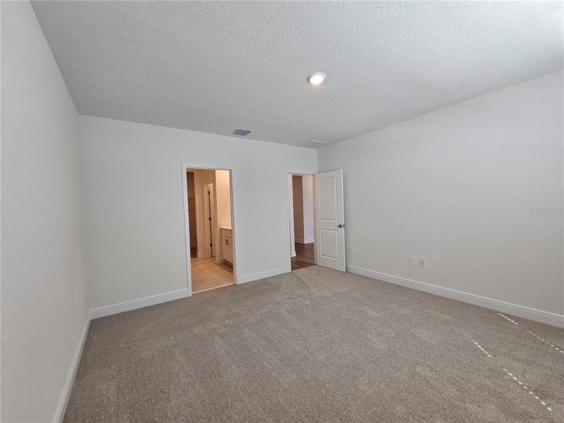 Spacious, unfurnished interior of a new home in The Reserve at Hammock Oaks - Signature Series, Lady Lake (Image 15).