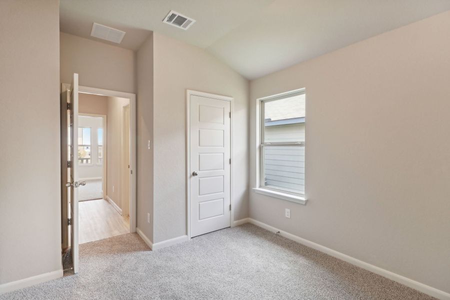 Guest bedroom in the Callaghan floorplan at a Meritage Homes community.