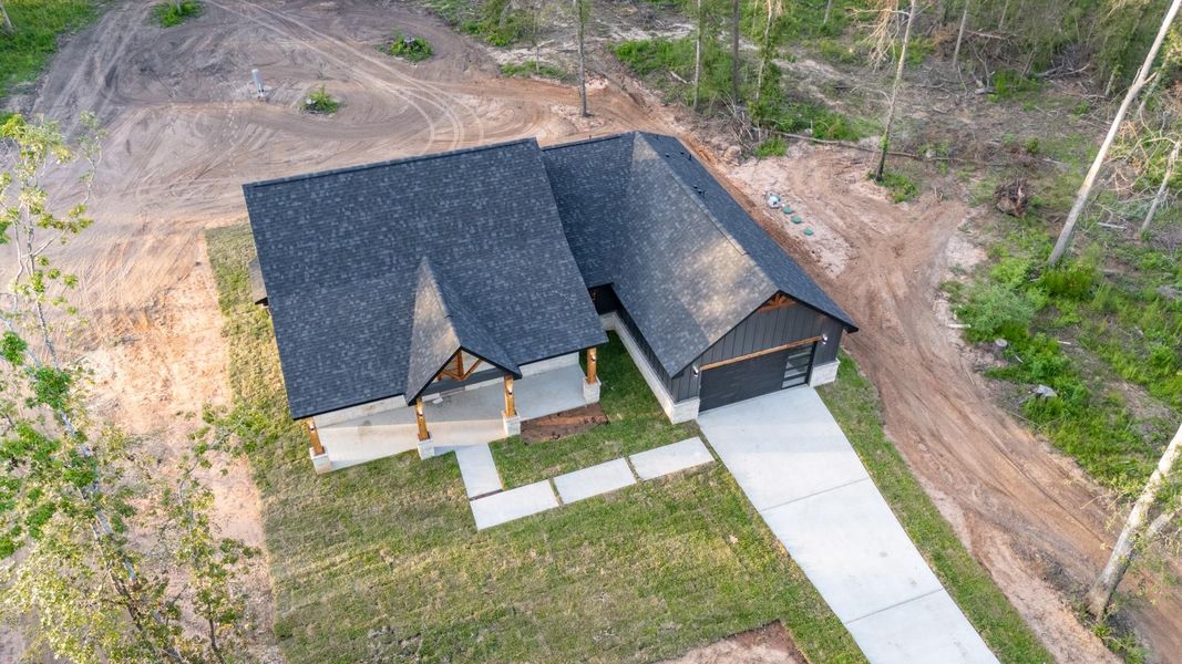 A view of the rear clearing and freshly graded soil, perfect for a future patio, workshop, garden, or pool—customize the backyard oasis of your dreams. A view of the rear clearing and freshly graded soil, perfect for a future patio, workshop, garden, or pool—customize the backyard oasis of your dreams.
