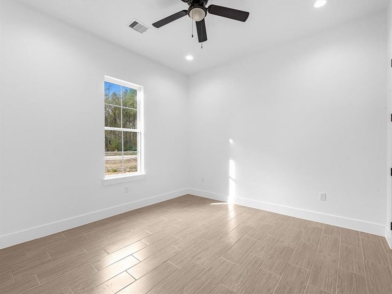 Bedroom, with great lighting and a ceiling fan.