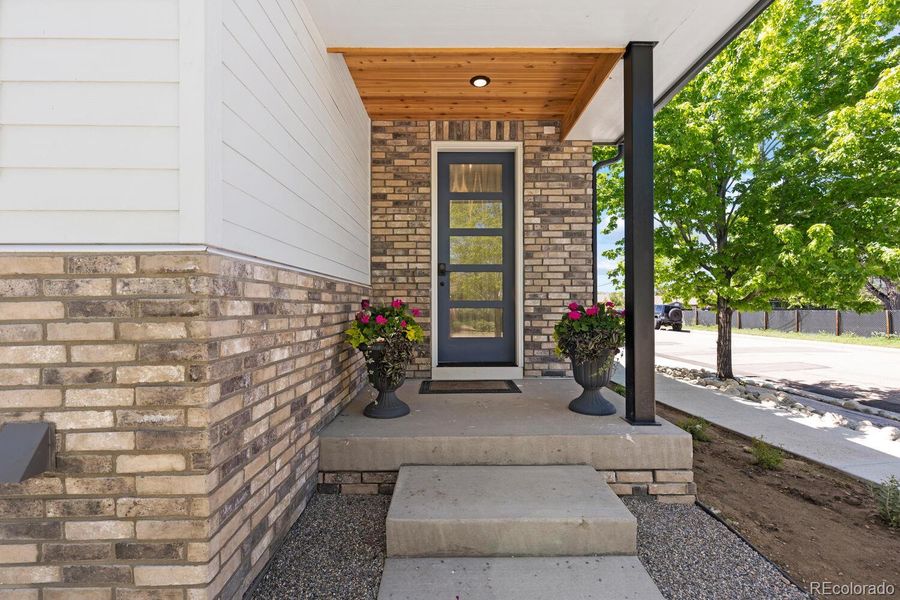 Covered porch leads to the modern front door Covered porch leads to the modern front door