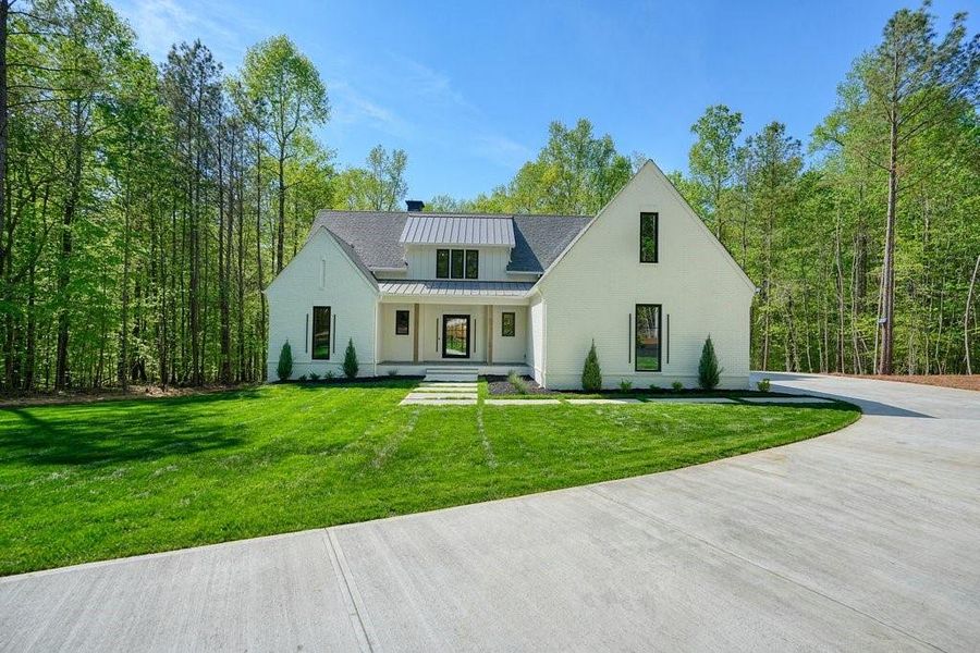 Front exterior of a new home in , Canton, GA, highlighting curb appeal (Image 31).