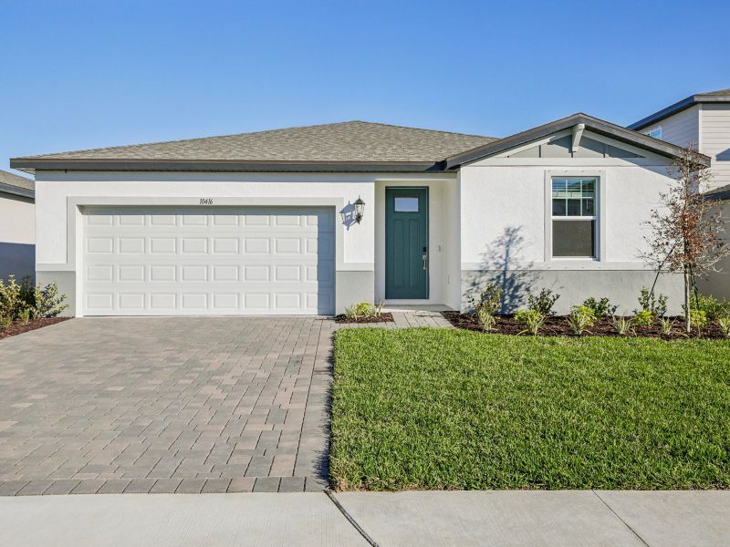 Front exterior of a new home in Salt Meadows - Classic Series, Parrish, FL, highlighting curb appeal (Image 1). Front exterior of a new home in Salt Meadows - Classic Series, Parrish, FL, highlighting curb appeal (Image 1).