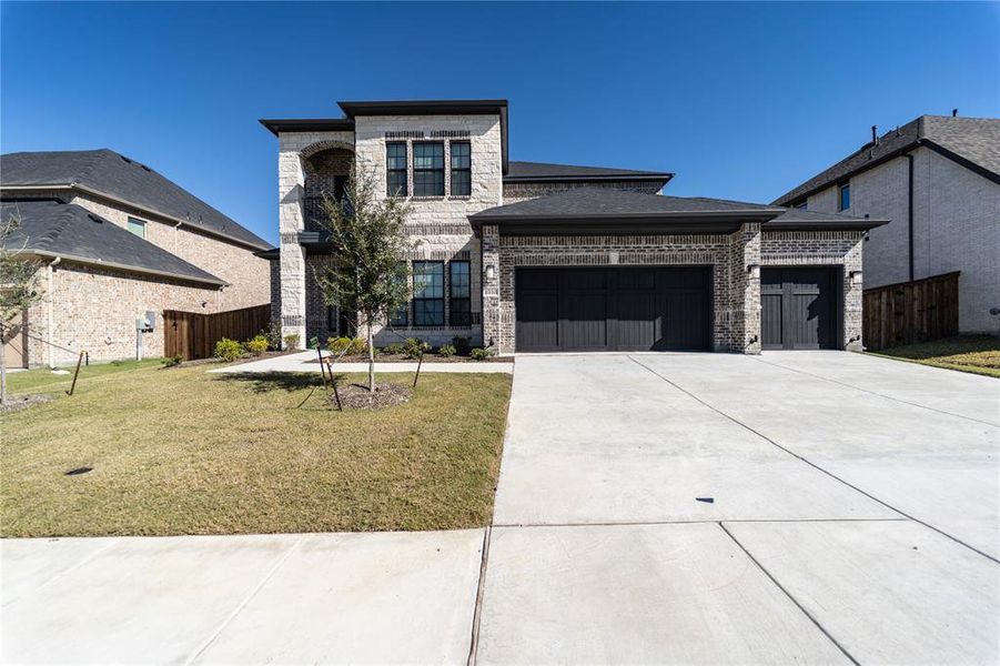 Front exterior of a new home in Sonoma Verde, Rockwall, TX, highlighting curb appeal (Image 1). Front exterior of a new home in Sonoma Verde, Rockwall, TX, highlighting curb appeal (Image 1).