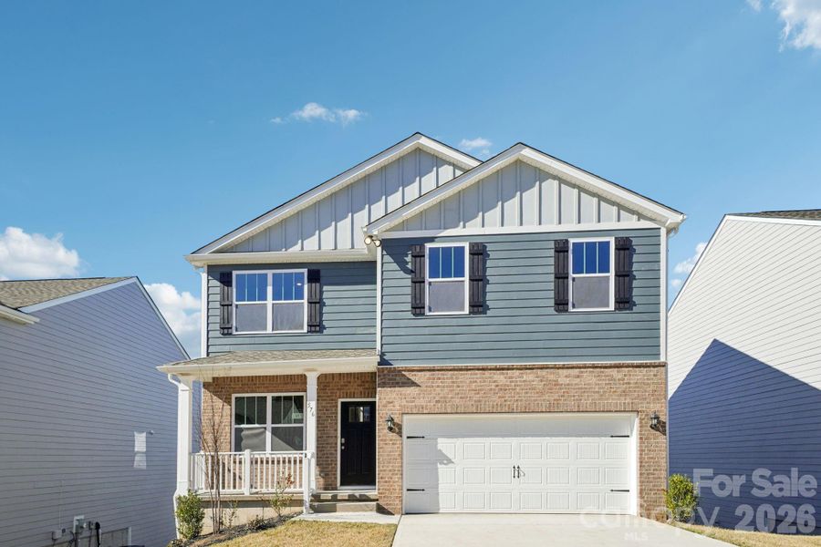 Front exterior of a new home in Rydele Heights, Asheville, NC, highlighting curb appeal (Image 1). Front exterior of a new home in Rydele Heights, Asheville, NC, highlighting curb appeal (Image 1).