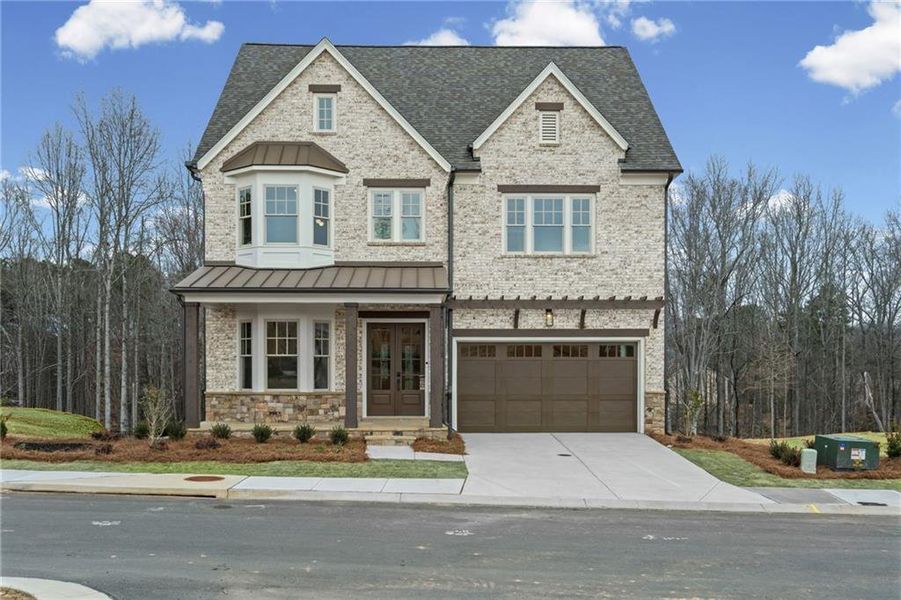 Front exterior of a new home in Laurel View, Suwanee, GA, highlighting curb appeal (Image 32). Front exterior of a new home in Laurel View, Suwanee, GA, highlighting curb appeal (Image 32).