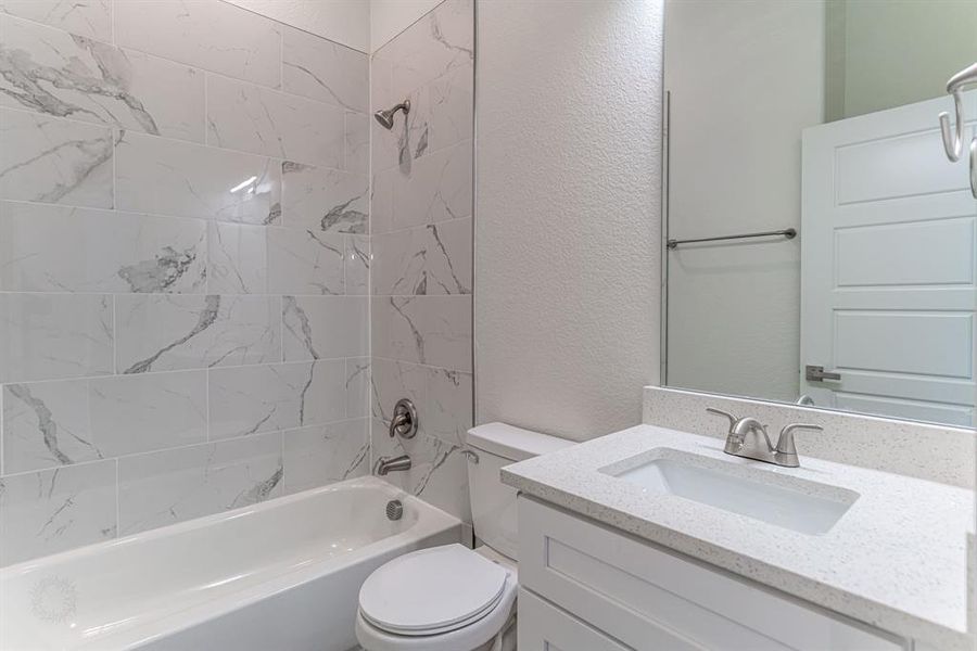 Bathroom with shower/tub combo and beautiful tile