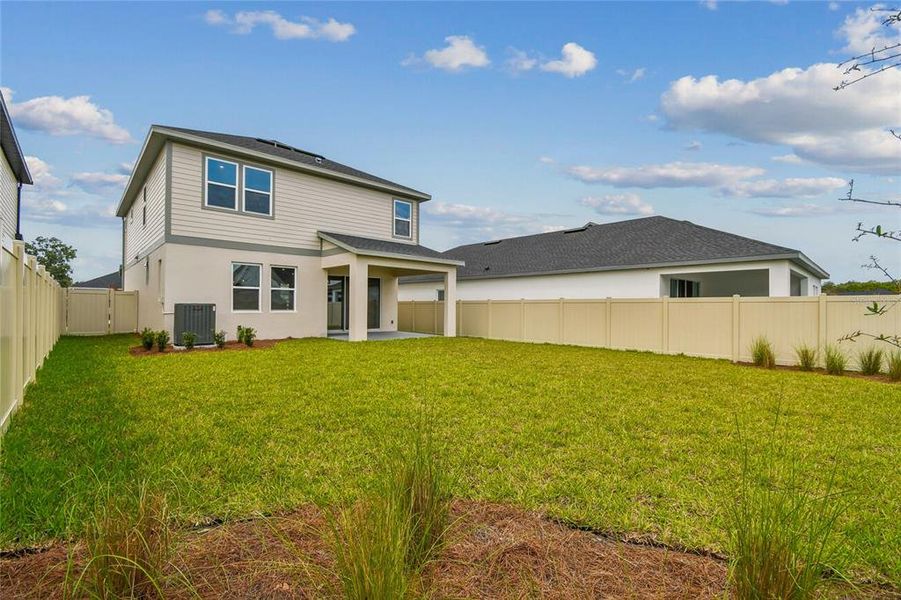 Exterior details and patio area of a home in Oakfield at Mount Dora Cottage Series, Mount Dora (Image 24).