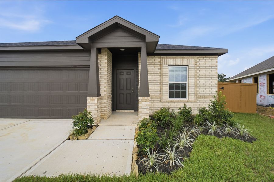 Front exterior of a new home in Cypress Green, Hockley, TX, highlighting curb appeal (Image 16). Front exterior of a new home in Cypress Green, Hockley, TX, highlighting curb appeal (Image 16).