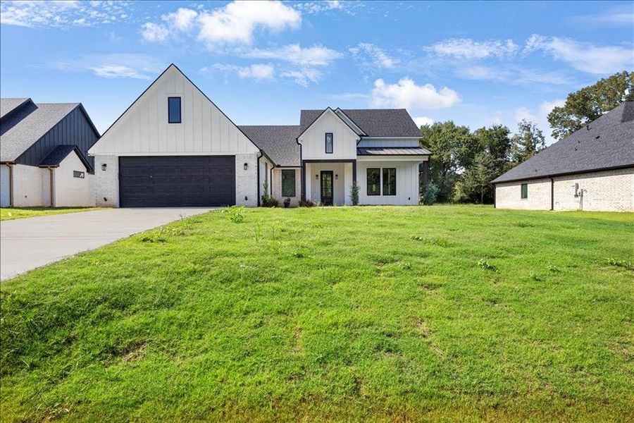 Front exterior of a new home in , Jacksonville, TX, highlighting curb appeal (Image 1). Front exterior of a new home in , Jacksonville, TX, highlighting curb appeal (Image 1).