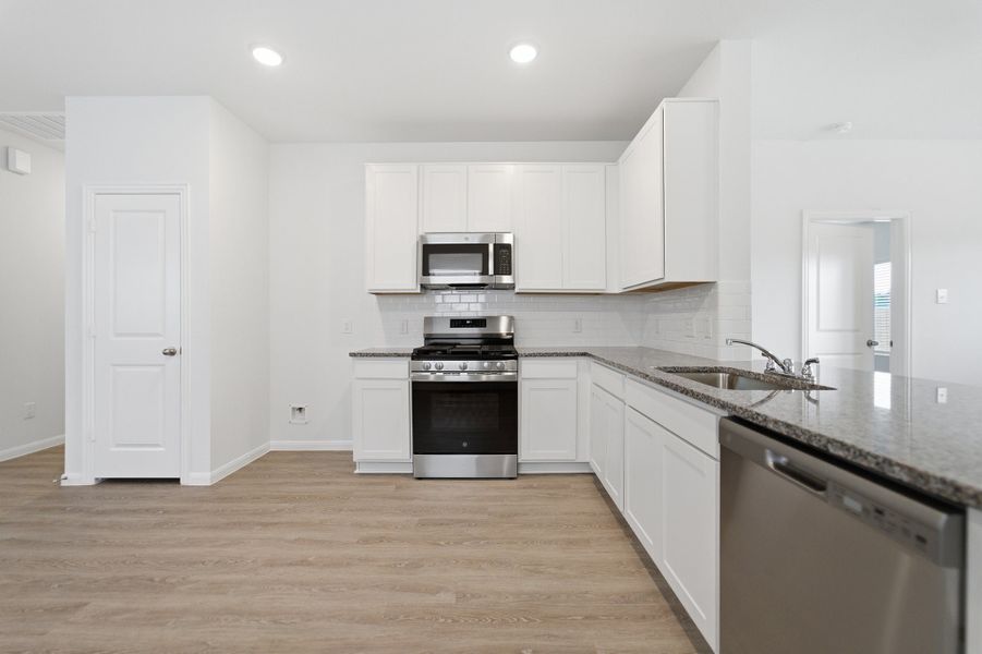 Furnished interior view inside a new home in The Pines at Seven Coves, Willis (Image 6).