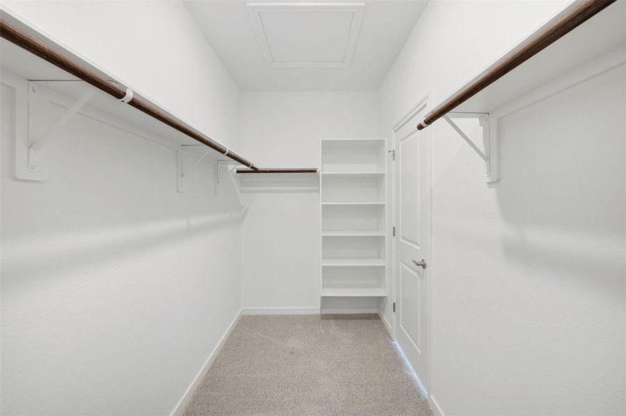 Primary walk-in closet Primary walk-in closet