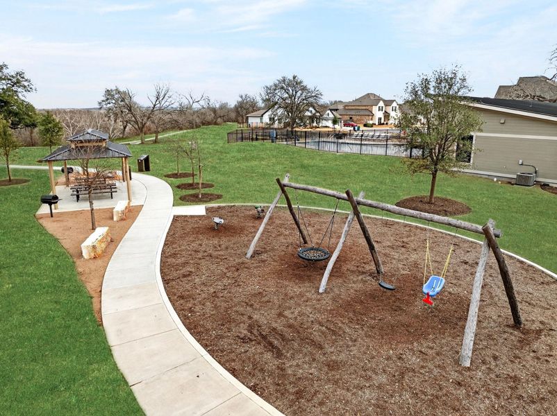 View of The Colony community featuring a playground, gazebo and a patio area