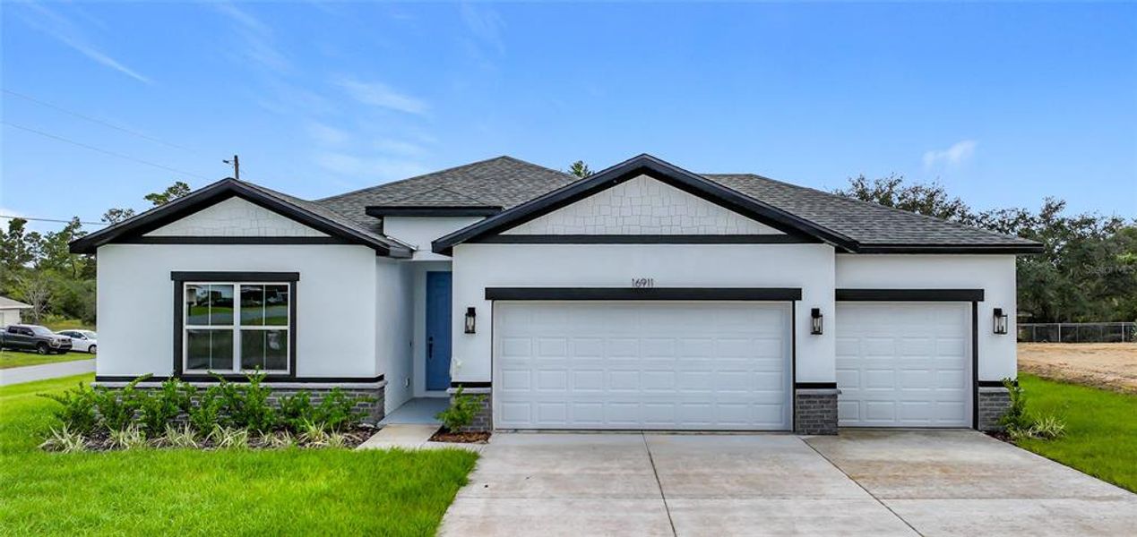 Front exterior of a new home in , Ocala, FL, highlighting curb appeal (Image 1). Front exterior of a new home in , Ocala, FL, highlighting curb appeal (Image 1).