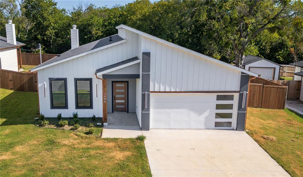 Front exterior of a new home in , Greenville, TX, highlighting curb appeal (Image 1). Front exterior of a new home in , Greenville, TX, highlighting curb appeal (Image 1).