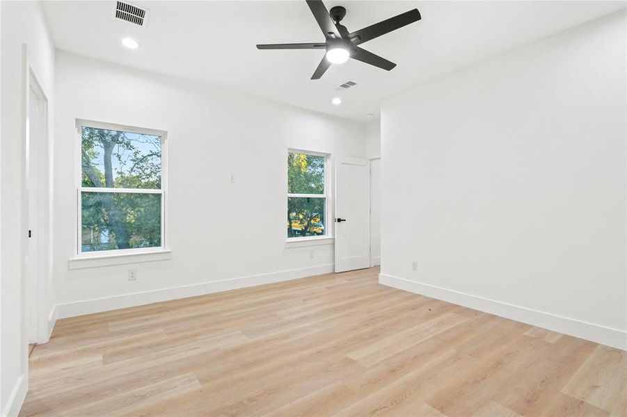 Unfurnished room featuring light wood-type flooring, recessed lighting, and ceiling fan Unfurnished room featuring light wood-type flooring, recessed lighting, and ceiling fan