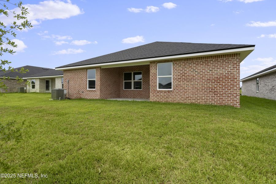 Front exterior of a new home in Shadow Crest at Rolling Hills, Green Cove Springs, FL, highlighting curb appeal (Image 15).