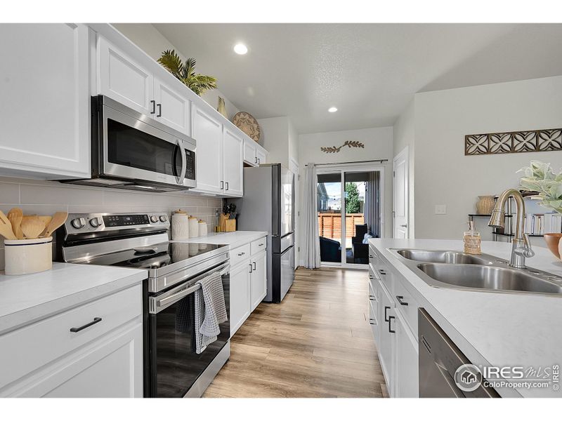 Kitchen with Island and Stainless Steel appliances