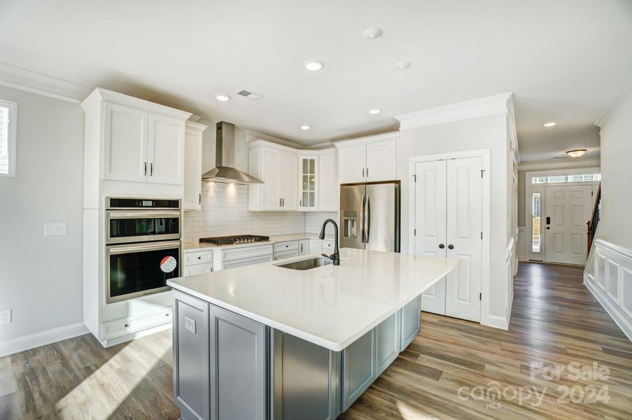 This home features all white cabinets and island