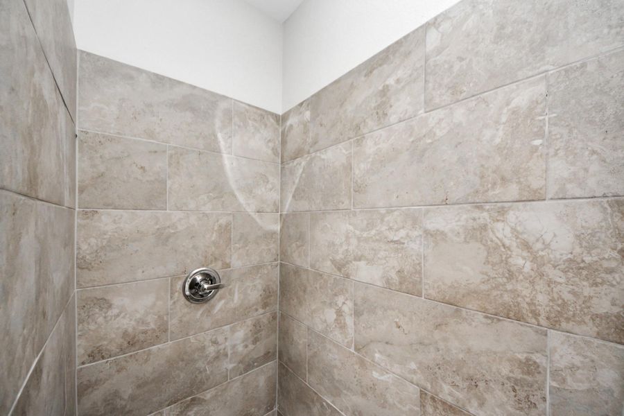 A closer look at the luxurious mud-set shower, complete with a rainfall showerhead—combining elegance and a spa-like experience in the primary bathroom - (representation photo).