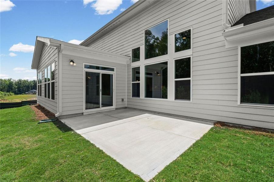 Exterior details and patio area of a home in Hidden Fields, Hoschton (Image 24).