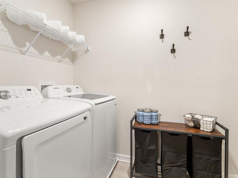 Enjoy the convenience of an upstairs dedicated laundry area - Flora townhome by Highland Homes