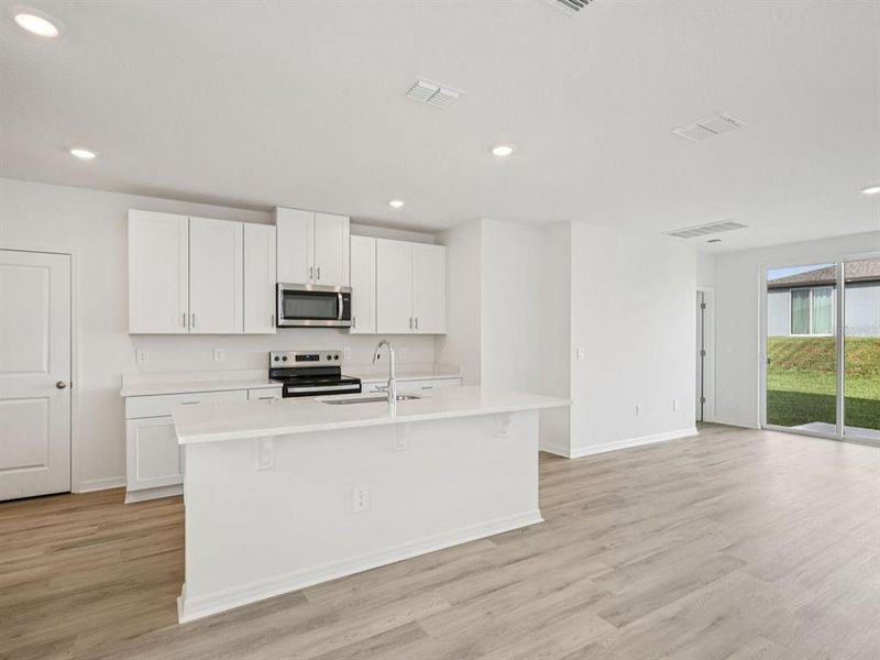 Furnished interior view inside a new home in Oakfield Trails - Premier Series, Parrish (Image 8).