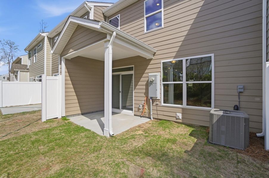 Exterior details and patio area of a home in Harrisburg Village Townhomes, Harrisburg (Image 28).
