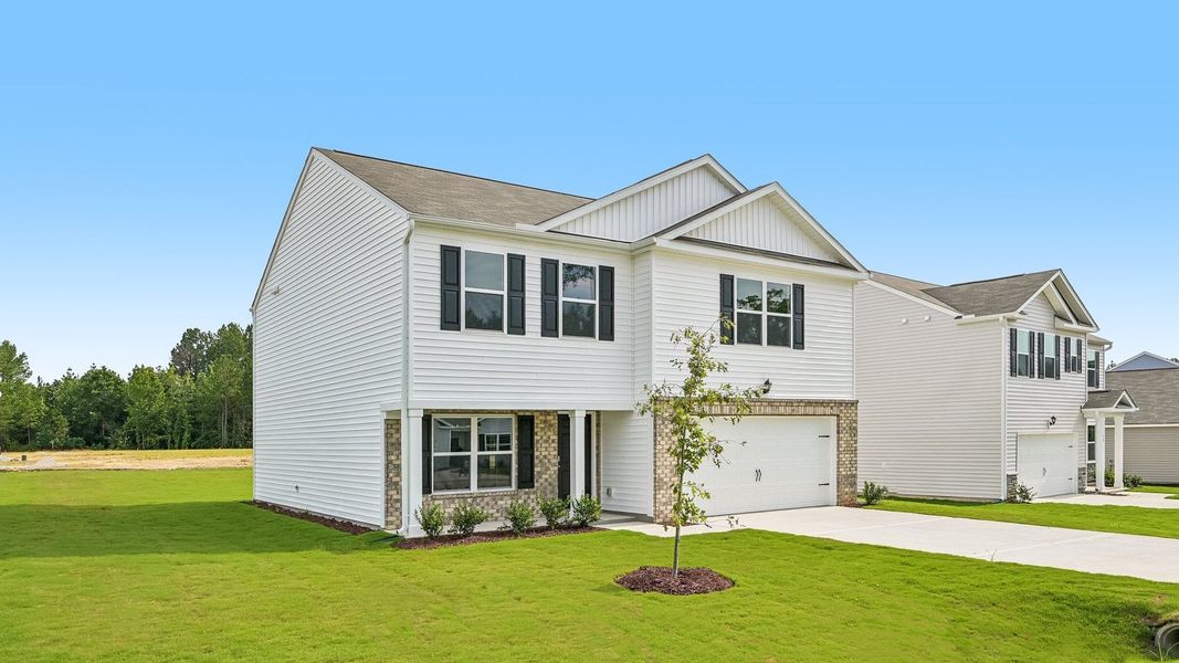 Front exterior of a new home in Mangum Farms, Stem, NC, highlighting curb appeal (Image 17).