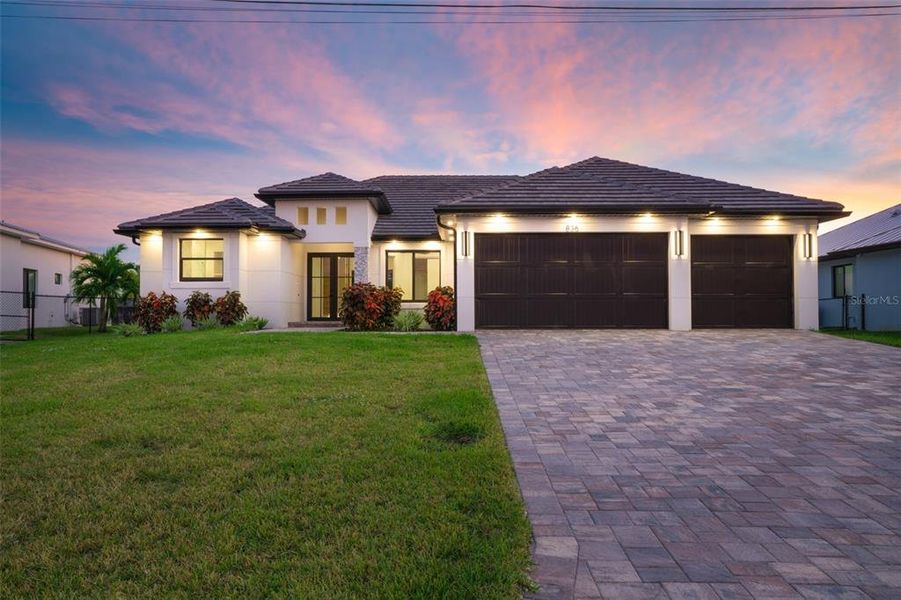 Front exterior of a new home in , Cape Coral, FL, highlighting curb appeal (Image 2).